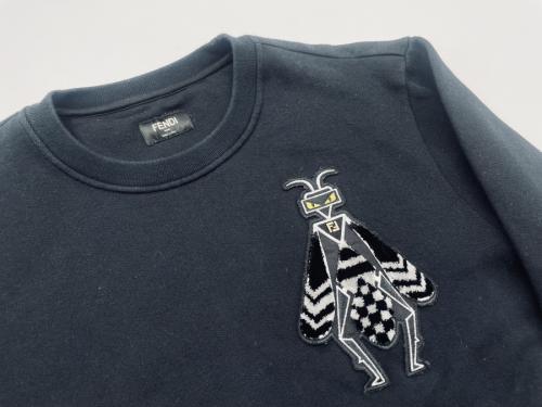 トップスのスウェット